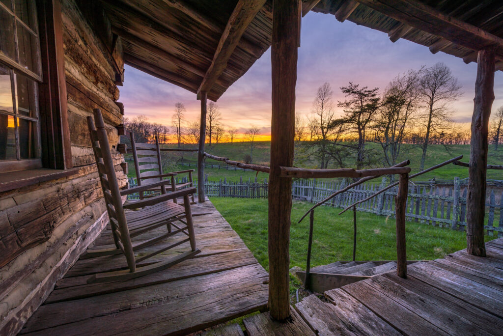 old worn porch with rocking chairs at sunset, appalachian mounta